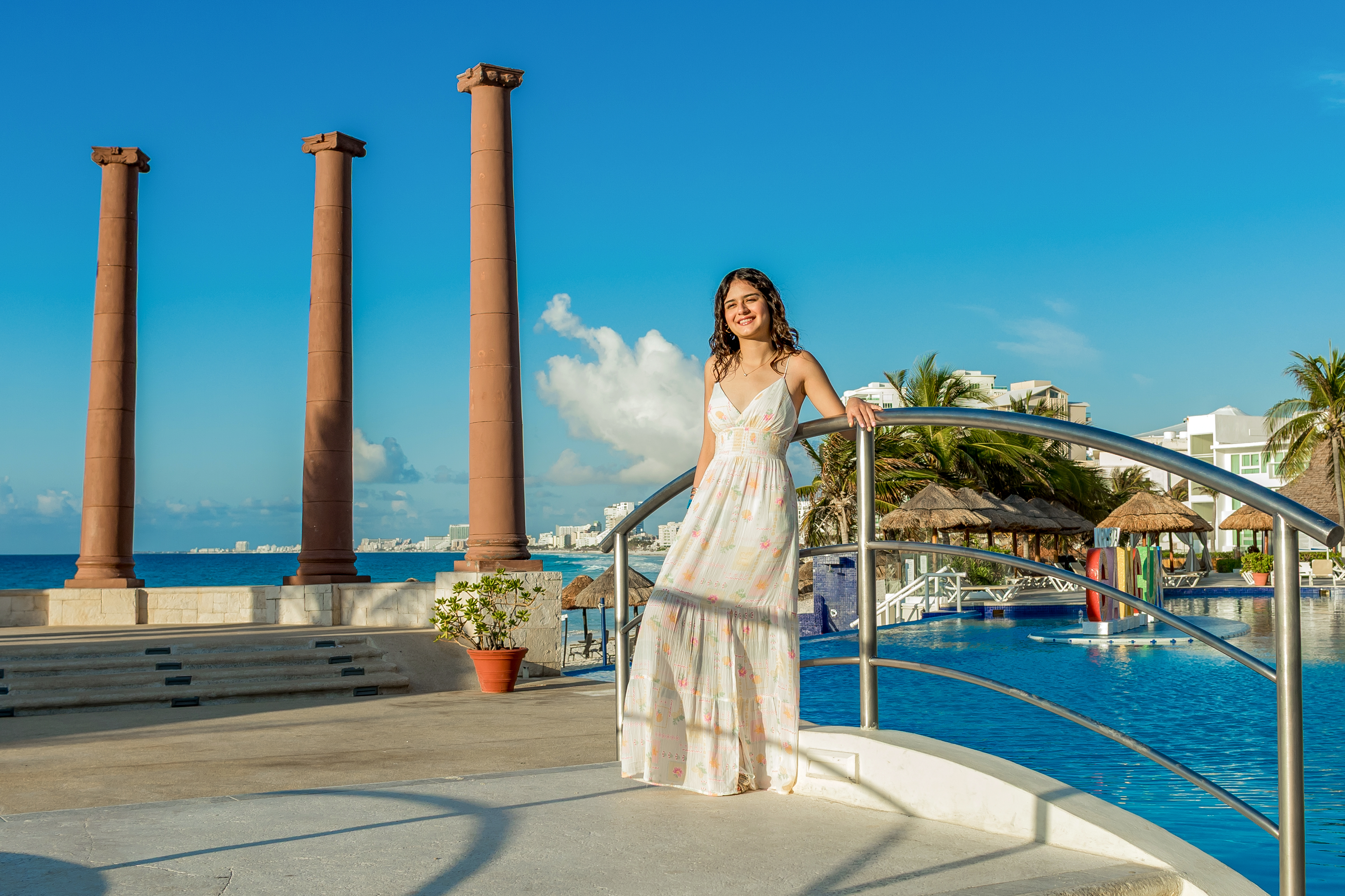Ximena, founder of Her Future STEM, standing outdoors by the ocean.
